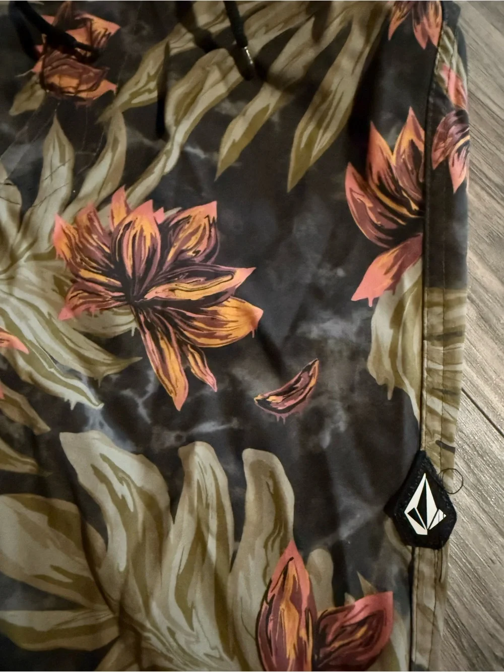 Volcom Youth boys monstera leaf print black Swim Shorts with Orange Floral Print